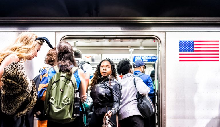 Passengers maneuver the NYC underground Subway Station on their morning commute.