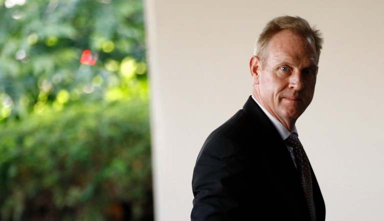 Acting Defense Secretary Patrick Shanahan walks into the U.S. State Department, Thursday, May 23, 2019, in Washington.