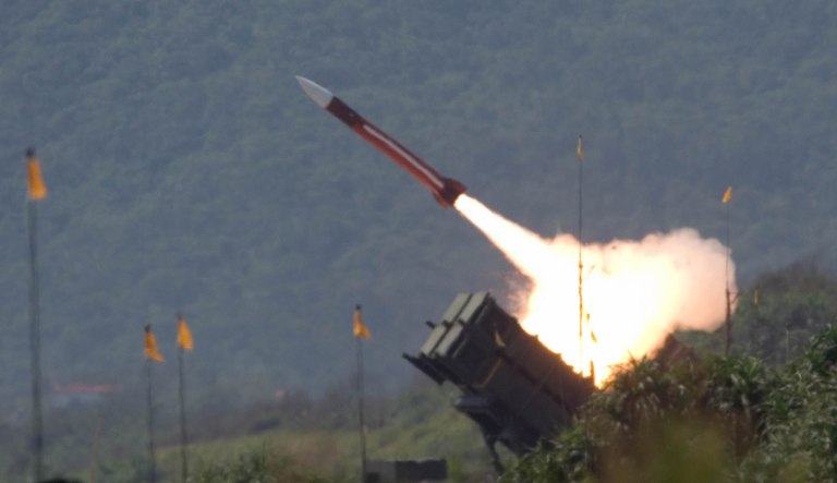 FILE - In this July 20, 2006 photo, a U.S.-made Patriot missile is launched during the annual Han Kuang No. 22 exercises in  Ilan County, 80 kilometers (49 miles) west of Taipei, Taiwan. The United States is planning to sell US$6.4 billion in arms, including Black Hawk helicopters, Patriot Advanced Capability-3 missiles, mine hunter ships and information technology, to Taiwan, a move that will infuriate China and test whether President Barack Obama's efforts to improve trust with Beijing will carry the countries through a tense time.