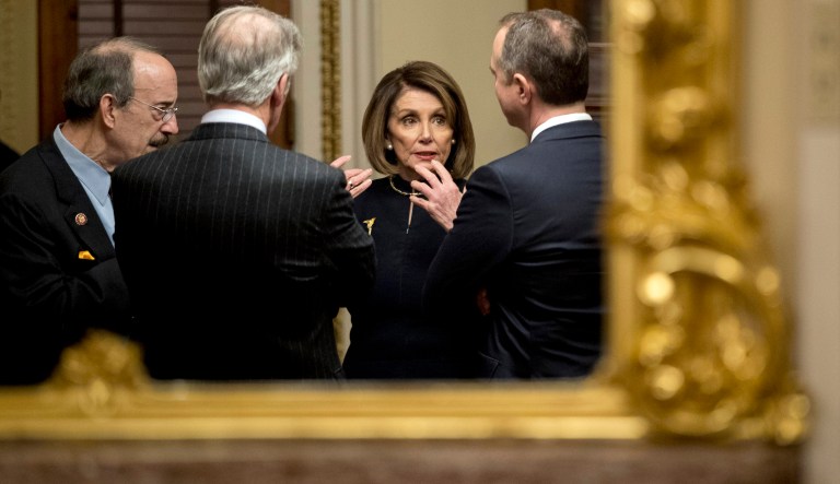 House Speaker Nancy Pelosi of Calif., center, speaks with House Intelligence Committee Chairman Adam Schiff, D-Calif., right, House Foreign Affairs Committee Chairman Eliot Engel, D-N.Y., left, and House Ways and Means Committee Chairman Richard Neal, D-Mass., second from left, in a private room just off the House floor after the House votes to impeach President Donald Trump, Wednesday, Dec. 18, 2019, on Capitol Hill in Washington.