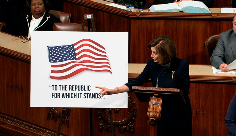 House Speaker Nancy Pelosi of Calif., points to a poster as she speaks as the House of Representatives debates the articles of impeachment against President Donald Trump at the Capitol in Washington, Wednesday, Dec. 18, 2019.