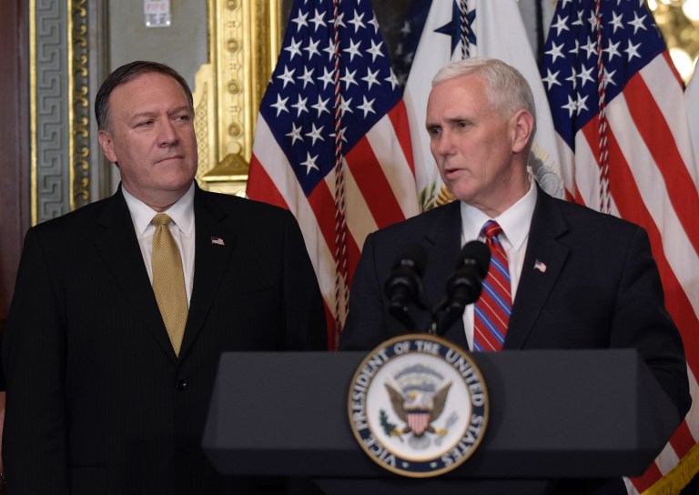 CIA Director Mike Pompeo, left, listens as Vice President Mike Pence speaks in the Vice President's Ceremonial Office in the Eisenhower Executive Office Building in the White House complex in Washington, Monday, Jan. 23, 2017, after Pompeo's swearing in. 