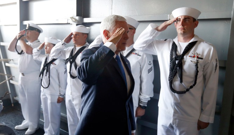 Vice President Mike Pence salutes as he arrives for a tour aboard the nuclear aircraft carrier USS Harry S. Truman at the Naval Station Norfolk in Norfolk, Va., Tuesday, April 30, 2019.
