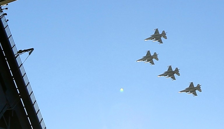 A flyover by four F-35s from the 309th Fighter Squadron from Luke Air Force Base concludes the national anthem prior to an opening day baseball game between the Arizona Diamondbacks and the Boston Red Sox Friday, April 5, 2019, in Phoenix.