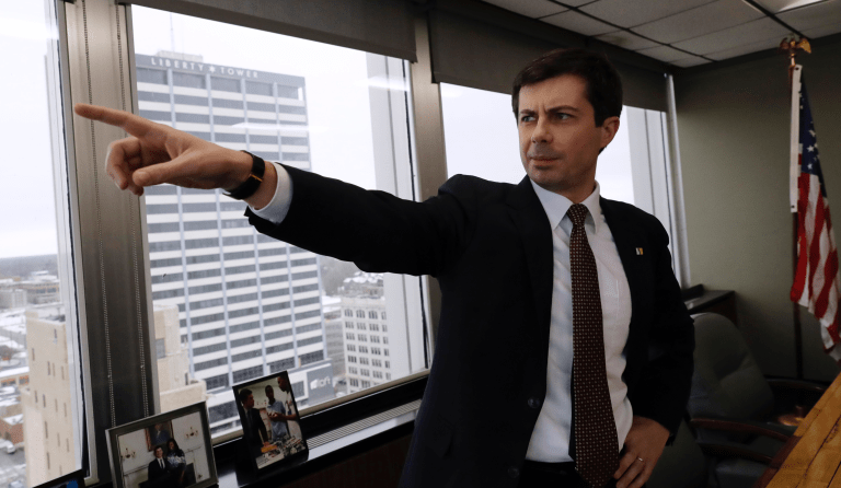 Mayor Pete Buttigieg points as he talks to an AP reporter at his office in South Bend, Ind., Thursday, Jan. 10, 2019. At 37, Pete Buttigieg is just a few years older than the minimum age required to serve as president of the United States. (AP Photo/Nam Y. Huh)