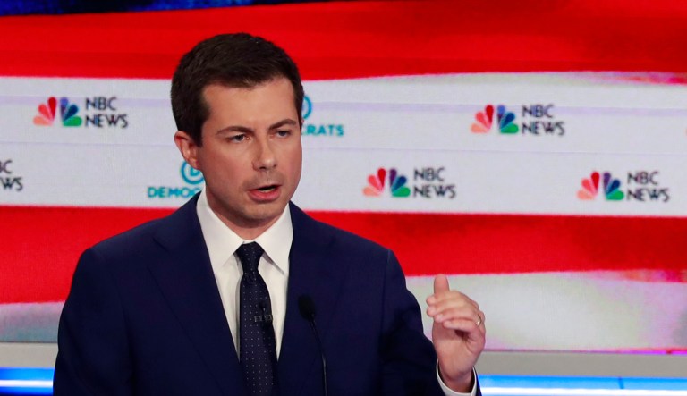 Democratic presidential candidate South Bend Mayor Pete Buttigieg, left, speaks as former vice president Joe Biden and Sen. Bernie Sanders, I-Vt., gesture, during the Democratic primary debate hosted by NBC News at the Adrienne Arsht Center for the Performing Art, Thursday, June 27, 2019, in Miami.