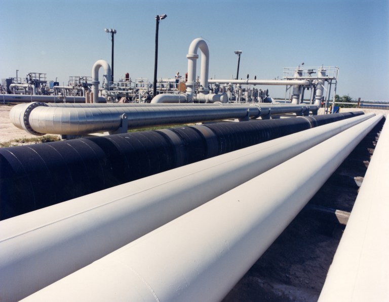 An undated photo provided by the Energy Department shows crude oil pipes at the Bryan Mound site near Freeport, Texas. The U.S. emergency fuel tank _ the Strategic Petroleum Reserve _ is almost full for the first time since its creation about 30 years ago. The most obvious significance is that it gives the country a larger energy-security blanket than ever for the economy in the event of a future supply disruption. And the federal budget will get a small boost as oil companies resume paying royalties in cash, not oil, for operating on government lands. But the stockpiling of 700 million barrels of oil, which is scheduled for completion by the end of August, also could bring some immediate relief to the global energy market.