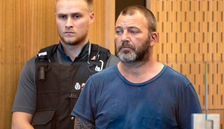 In this March 20, 2019, file photo, Philip Arps stands in the dock at the District Court in Christchurch, New Zealand. Arps has pleaded guilty to sharing a livestream video that was recorded by a gunman as he began killing 50 people at two mosques in New Zealand and will remain in jail until heâs sentenced on June 14.