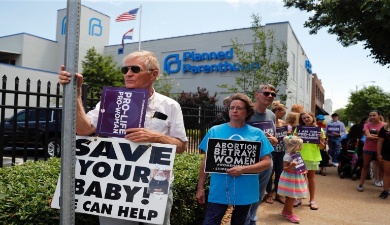 Anti-abortion supporters gather outside the Planned Parenthood clinic Tuesday, June 4, 2019, in St. Louis. 
