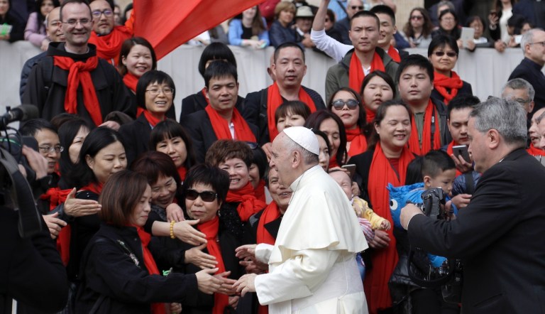 Pope Francis meets a group of faithful from China at the end of his weekly general audience in St. Peter's Square, at the Vatican, Wednesday, April 18, 2018. 