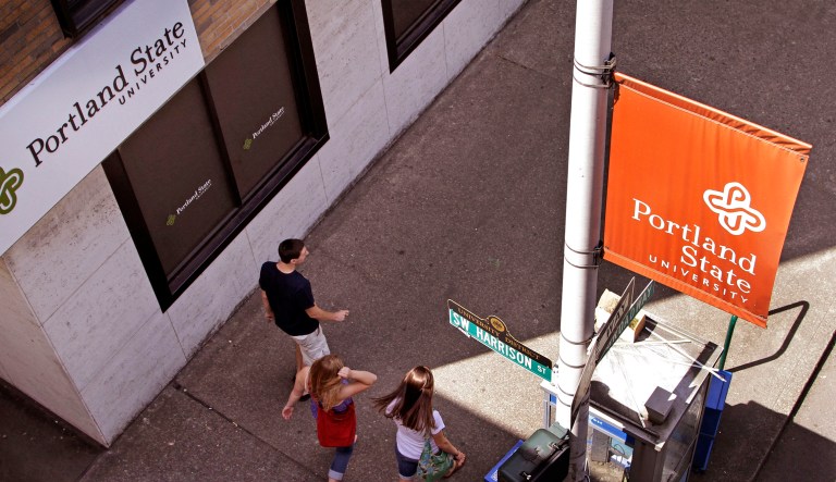 FILE - In this June 25, 2010, file photo, students walk across campus at Portland State University in Portland, Ore. The Supreme Court's decision to uphold the Trump Administration's travel restrictions on certain countries directly affects more than 180 international students at Oregon's largest public universities. Portland State University has students from five of the seven travel-ban countries, and officials say if any of those students go home, they either can't return here or it's risky.