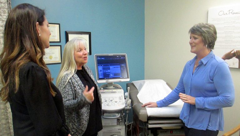 In this Feb. 8, 2018, photo, Blayne Wittig, executive director of Options for Women of California, left, a center in Concord, Calif., Debbie Whittaker, nurse manager, center, and Christine Vatuone, president and CEO of Informed Choices, talk at Informed Choices, a crisis pregnancy center in Grilroy, Calif. A California law regulating anti-abortion pregnancy centers has led to a Supreme Court clash at the intersection of abortion and free speech. The centers say a law requiring them to tell pregnant clients the state has family planning and abortion care available at little or no cost violates the centersâ free speech rights. Informed Choices is what Vatuone describes as a âlife-affirmingâ pregnancy center. Even as it advertises âfree pregnancy servicesâ and promises in signs on its door and inside to discuss all options with pregnant women, Informed Choices exists to steer women away from abortion. 