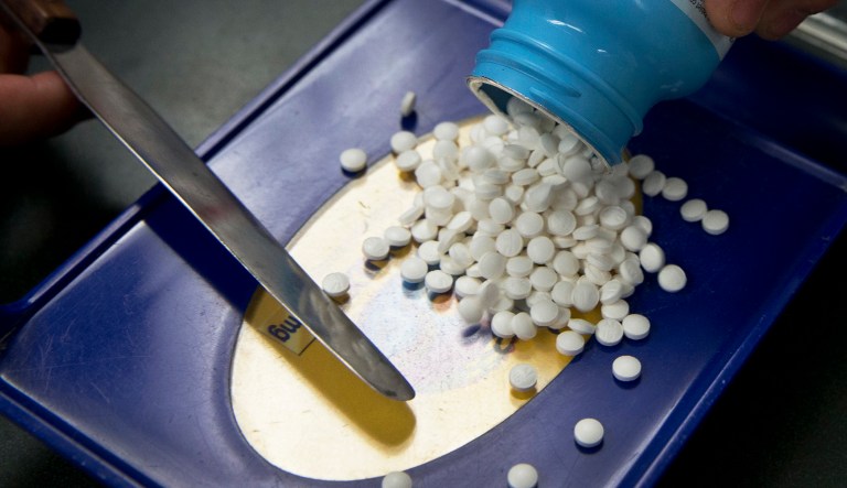 FILE - In this Friday, July 8, 2016 file photo, a prescription is filled at a pharmacy in Sacramento, Calif.