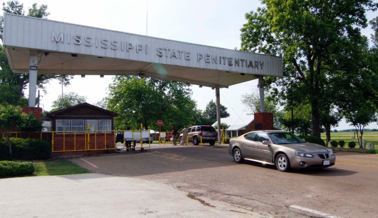 In this May 19, 2010 photograph, traffic moves past the front of the Mississippi State Penitentiary in Parchman, Miss.  On Friday, June 4, 2010, the American Civil Liberties Union asked a federal judge to dismiss its lawsuit against the Mississippi Department of Corrections over conditions at the maximum security Unit 32 on the Parchman campus, after having reached a proposed agreement with the MDOC to shutter the facility at the state penitentiary.