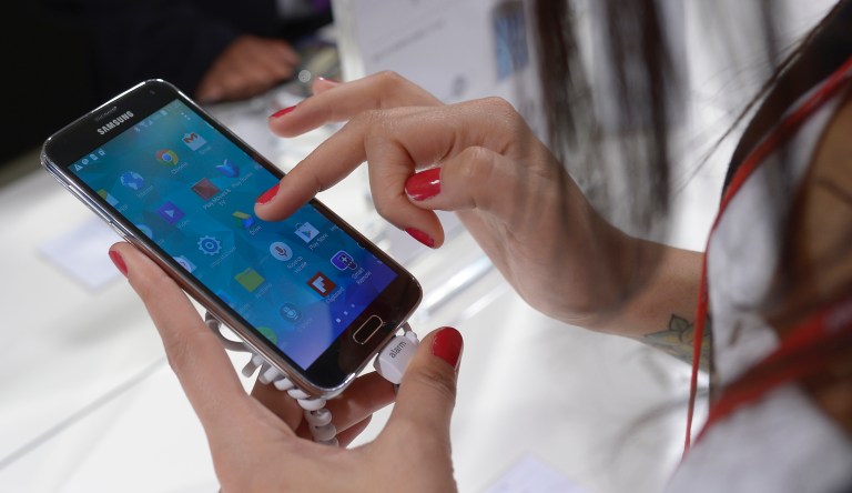 In this Feb. 25, 2014 file photo, the Samsung Galaxy S5 is displayed at the Mobile World Congress in Barcelona, Spain, Tuesday, Feb. 25, 2014. 