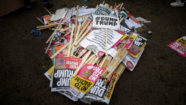 Placards showing anti-Trump messages lie on the ground, in central London, near the end of a protest against the state visit of President Donald Trump, Tuesday, June 4, 2019. Trump will turn from pageantry to policy Tuesday as he joins British Prime Minister Theresa May for a day of talks likely to highlight fresh uncertainty in the allies' storied relationship. 