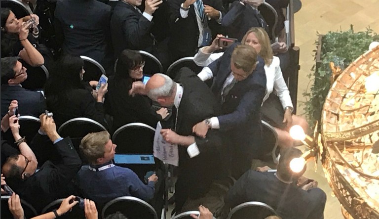 Protester forcibly removed from room ahead of Trump, Putin joint press conference