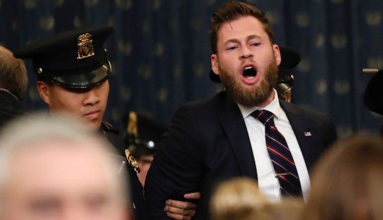A protester is removed from the hearing room as the House Judiciary Committee hears investigative findings in the impeachment inquiry of President Donald Trump, Monday, Dec. 9, 2019, on Capitol Hill in Washington.                                        