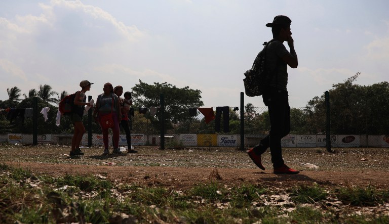 Central American migrants participating in the annual Migrant Stations of the Cross caravan or "Via crucis," organized by the "Pueblo Sin Fronteras" activist group, mill around a sports center during the group's few-days stop in Matias Romero, Oaxaca state, Mexico, Monday, April 2, 2018. A Mexican government official said the caravans are tolerated because migrants have a right under Mexican law to request asylum in Mexico or to request a humanitarian visa allowing travel to the U.S. border to seek asylum in the United States.
