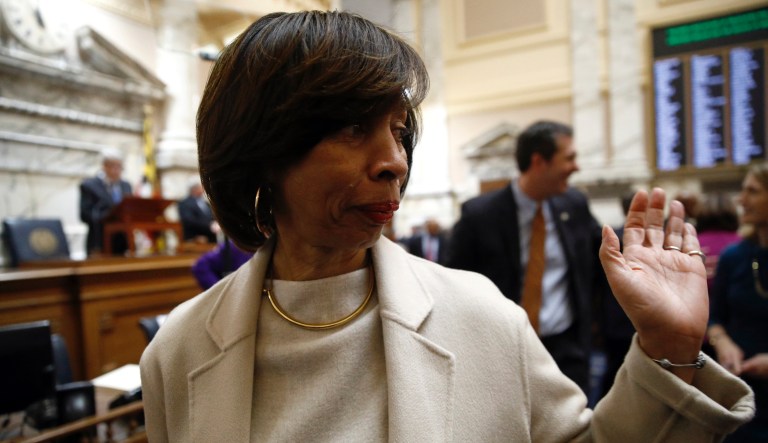 Baltimore Mayor Catherine Pugh walks on the Maryland House of Delegates chamber floor before Gov. Larry Hogan's annual State of the State address to a joint session of the legislature in Annapolis, Md., Wednesday, Jan. 30, 2019.