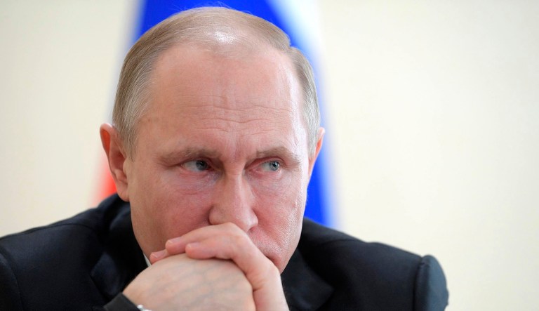 Russian President Vladimir Putin attends a meeting with local officials after visiting a memorial for the victims of a fire in a multi-story shopping center in the Siberian city of Kemerovo, about 3,000 kilometers (1,900 miles) east of Moscow, Russia, Tuesday, March 27, 2018. Officials say that the fire escapes were blocked and a PA system was turned off during the fire that killed over 50 people.