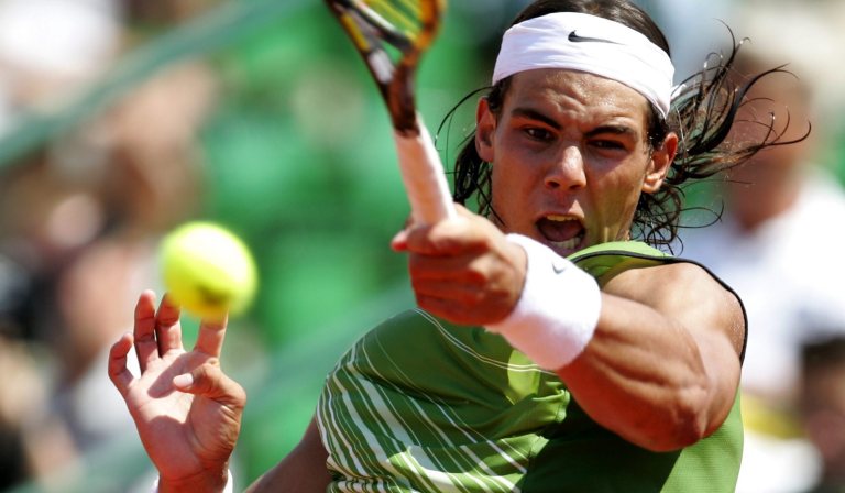 Spanish Rafael Nadal returns a shot during his semifinal match against Spanish Tommy Robredo, at Swedish Open tennis tournament in Bastad Tennis Stadium, Saturday, July. 9, 2005.  Nadal won the match 6-3, 6-3. 