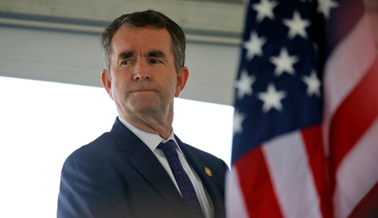 Gov. Ralph Northam waits to speak during an event in Norfolk to announce finance agreements for the Hampton Roads Bridge-Tunnel expansion project Thursday, April 25, 2019.