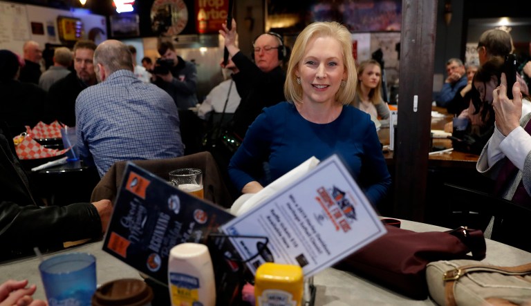 Sen. Kirsten Gillibrand, D-N.Y., center, greets local residents Monday, Feb. 18, 2019, in Cedar Rapids, Iowa.