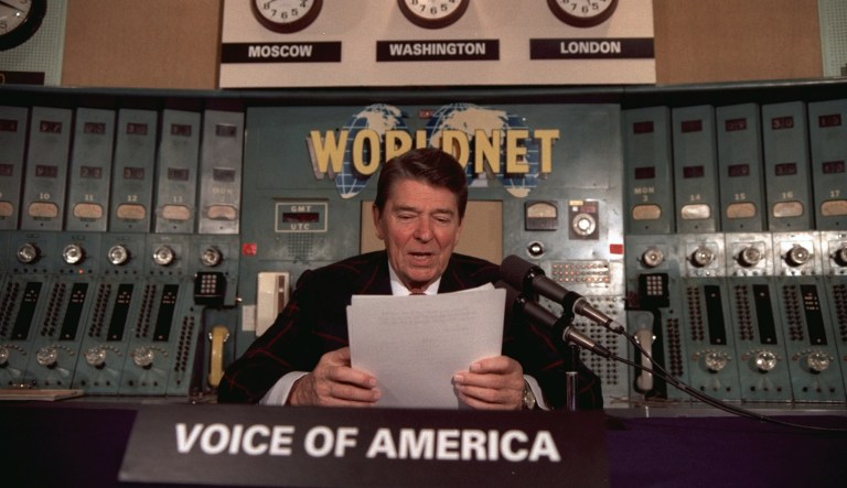 President Ronald Reagan gives his weekly radio address, Saturday, November 9, 1985, at the Voice of America studio in Washington. 