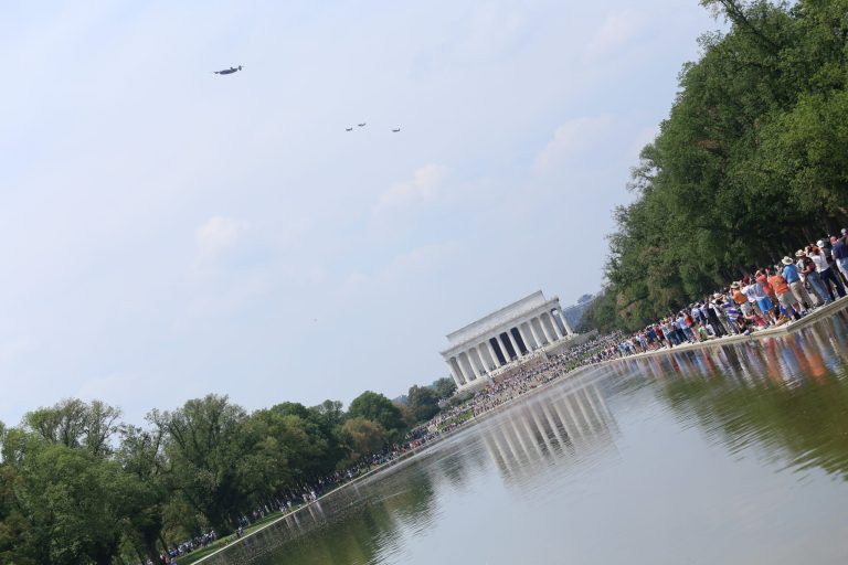 Thousands gather for WWII tribute and flyover