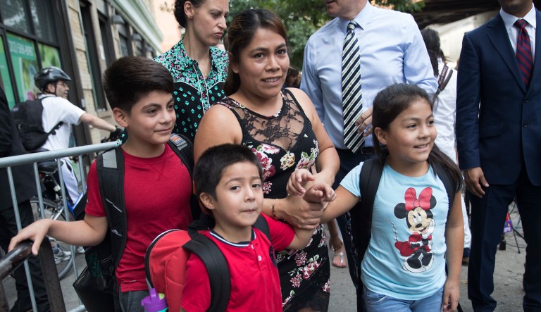 Yeni Gonzalez, center, leaves the Cayuga Centers with her children Lester, 11, from left, Deyuin, 6, and Jemelin, 9, after being reunited with her children, Friday, July 13, 2018, in New York. Gonzalez, who was separated from her three children at the U.S.-Mexico border, was reunited on Tuesday at the social services center.