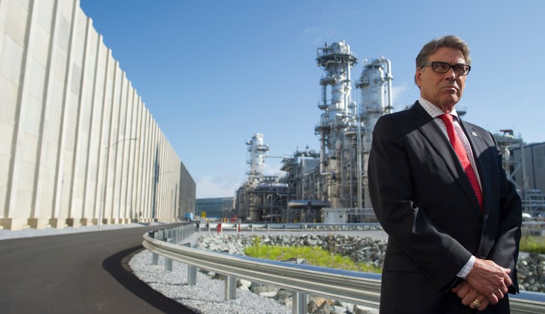 Secretary of Energy Rick Perry stands with the main cyrogenic heat exchange behind him as he speaks with reporters at Dominion Energy's Cove Point LNG liquefaction Project facility in Lusby, Md., Thursday, July 26, 2018. The completion of the facilities export expansion project makes it just the second LNG export facility in the U.S.