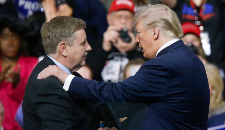 President Donald Trump, right, talks with Republican Rick Saccone during a campaign rally, Saturday, March 10, 2018, in Moon Township, Pa.