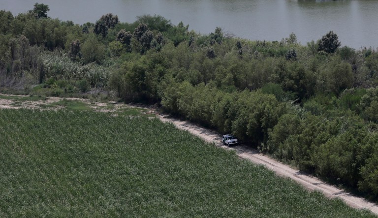 FILE - In this July 24, 2014, file photo, a Customs and Border Protection vehicle patrols on the Texas border near the Rio Grande in Mission, Texas. As hundreds of National Guard troops deploy to the U.S-Mexico border, residents of Texas' southernmost border region are fearful of the impact President Donald Trump's border wall will have. The troops patrolling the Rio Grande will eventually withdraw, but a wall could change the river forever.