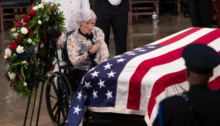 Roberta McCain, the 106-year-old mother of Sen. John McCain of Arizona, stops at his flag-draped casket in the U.S. Capitol rotunda during a farewell ceremony, Friday, Aug. 31, 2018, in Washington. McCain was a six-term senator, a former Republican nominee for president, and a Navy pilot who served in Vietnam, where he endured five-and-a-half years as a prisoner of war. He died Aug. 25 from brain cancer at age 81.