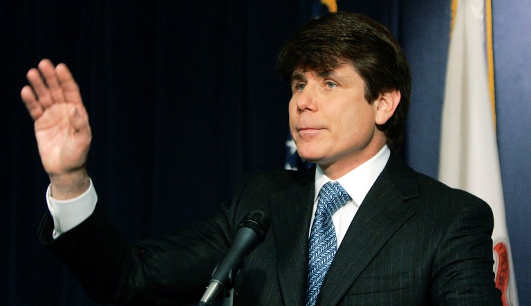 Illinois Governor Rod Blagojevich wave asfter delivering his first news conference since being arrested on numerous federal charge Friday, December 19, 2008. 