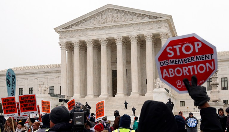 A marcher holds up a sign during the March for Life 2016, in front of the U.S. Supreme Court,  Friday, Jan. 22, 2016 in Washington. January 22 is the anniversary of 1973 'Roe v. Wade' U.S. Supreme Court decision legalizing abortion.