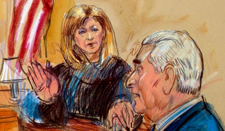 This courtroom sketch shows former campaign adviser for President Donald Trump, Roger Stone talking from the witness stand as prosecution attorney Jonathan Kravis, standing left, Stone's attorney Bruce Rogow, third from right, and Judge Amy Berman Jackson listen, during a court hearing at the U.S. District Courthouse in Washington, Thursday, Feb. 21, 2019. Berman Jackson issued a broad gag order forbidding Stone to discuss his criminal case with anyone and gave him a stinging reprimand over his posting of a photo of the judge with what appeared to be crosshairs of a gun.