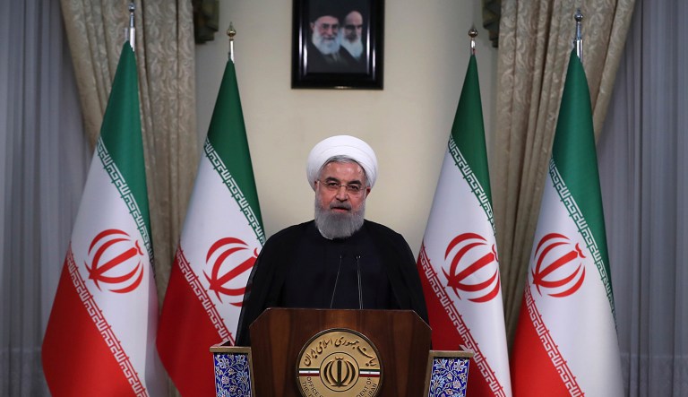 In this photo released by official website of the office of the Iranian Presidency, President Hassan Rouhani addresses the nation in a televised speech in Tehran, Iran, Tuesday, May 8, 2018. Iranian President Hassan Rouhani said Tuesday he'd send his foreign minister to negotiate with countries remaining in the nuclear deal after Donald Trump's decision to pull America from the deal, warning he otherwise would restart enriching uranium "in the next weeks."