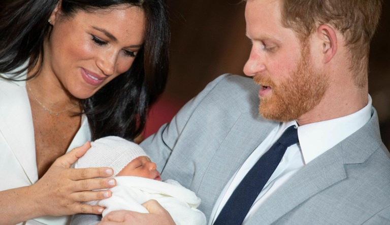 Britain's Prince Harry and Meghan, Duchess of Sussex, during a photocall with their newborn son, in St George's Hall at Windsor Castle, Windsor, south England, Wednesday May 8, 2019.