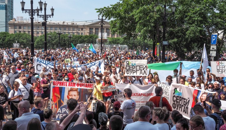 People hold posters reading "Freedom for Khabarovsk region's Gov. Sergei Furgal," "I'm Sergei Furgal," "We are Sergei Furgal," and "Call Furgal home" during an unsanctioned protest in Khabarovsk, a city 6,100 kilometers (3,800 miles) east of Moscow, on Saturday.