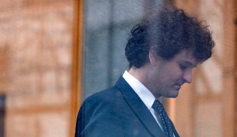 Cryptocurrency entrepreneur Sam Bankman-Fried arrives for an appearance at Manhattan federal court Tuesday, Jan. 3, 2023, in New York. Bankman-Fried will be arraigned in a Manhattan federal court Tuesday on charges that he cheated investors and looted customer deposits on his cryptocurrency trading platform.