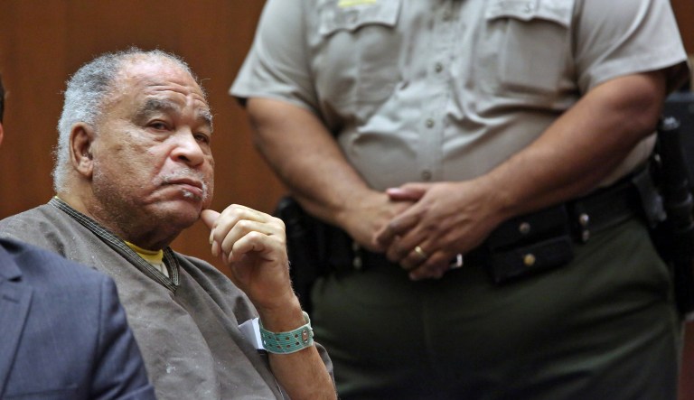 Samuel Little listens as he is sentenced to three consecutive terms of life in prison without parole for murdering three women in the late 1980s, in a Los Angeles courtroom Thursday, Sept. 25, 2014. 