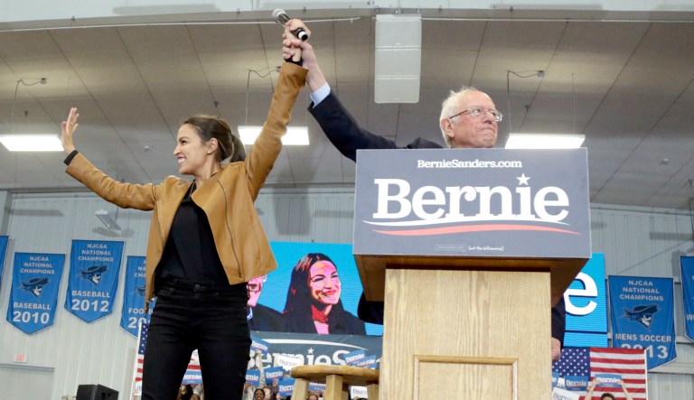 Democratic presidential candidate Sen. Bernie Sanders, I-Vt., and Rep. Alexandria Ocasio-Cortez, D-N.Y., stand on stage on the campus of Iowa Western Community College in Council Bluffs, Iowa, Friday, Nov. 8, 2019.