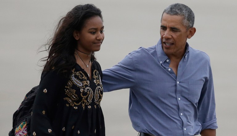 Barack Obama, right, and daughter Sasha, left, on the tarmac to board Air Force One at the Cape Cod Coast Guard Station, in Bourne, Mass., Sunday, Aug. 21, 2016.