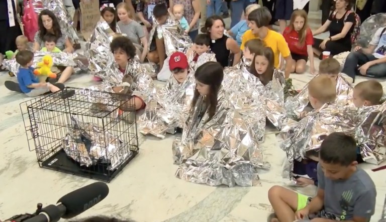 Capitol Hill protest has kids, cages, and thermal blankets, mirroring detention center conditions