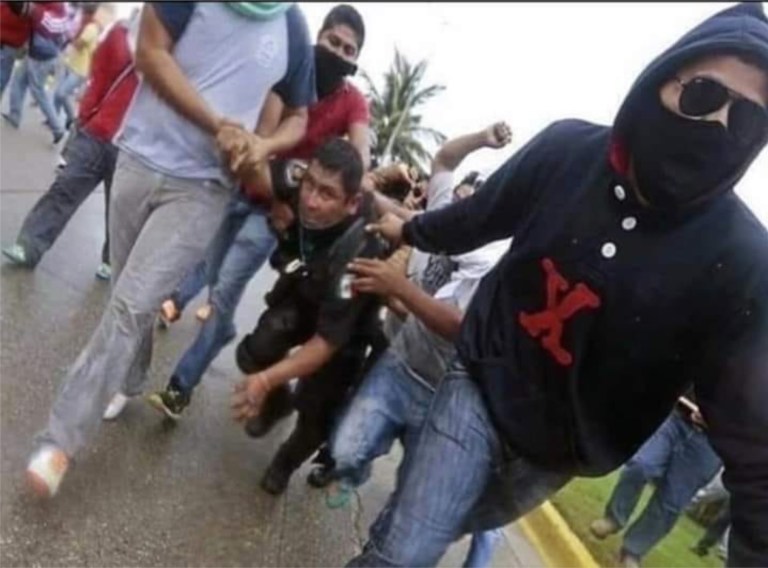 Fact Check: Does This Image Show a “Mexican Official being Dragged by the Caravan”?