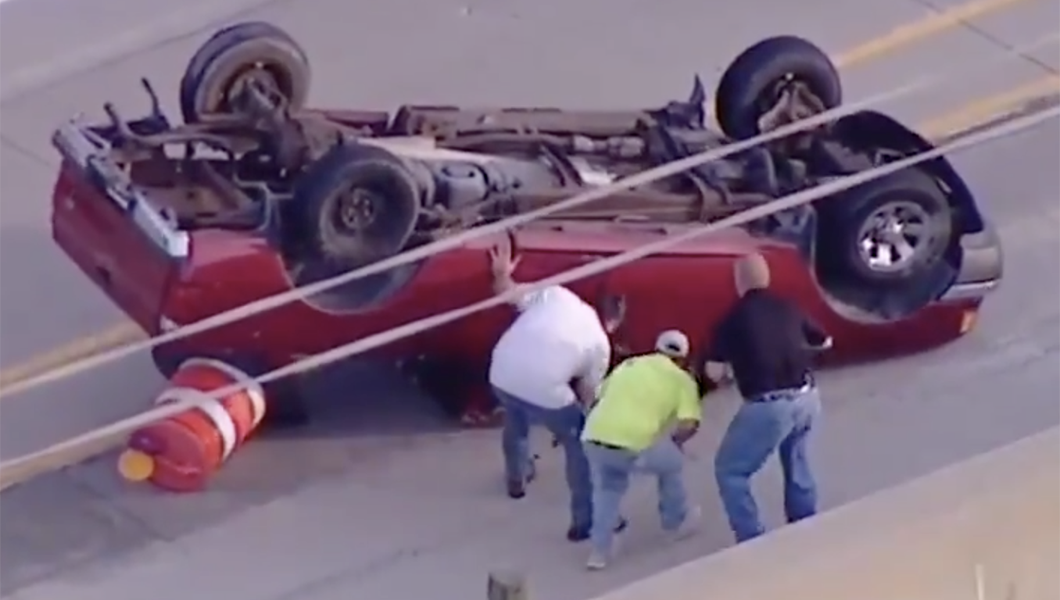 Group of strangers saves man in flipped truck