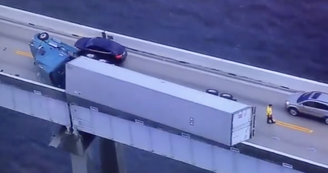Overturned tractor-trailer clings to edge of Bay Bridge, stalls traffic for hours