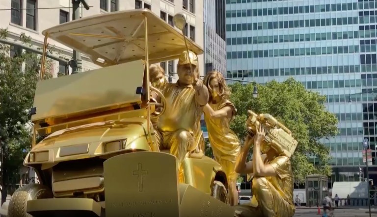 ‘Living statue’ in New York City shows Trump running over coronavirus and military graves